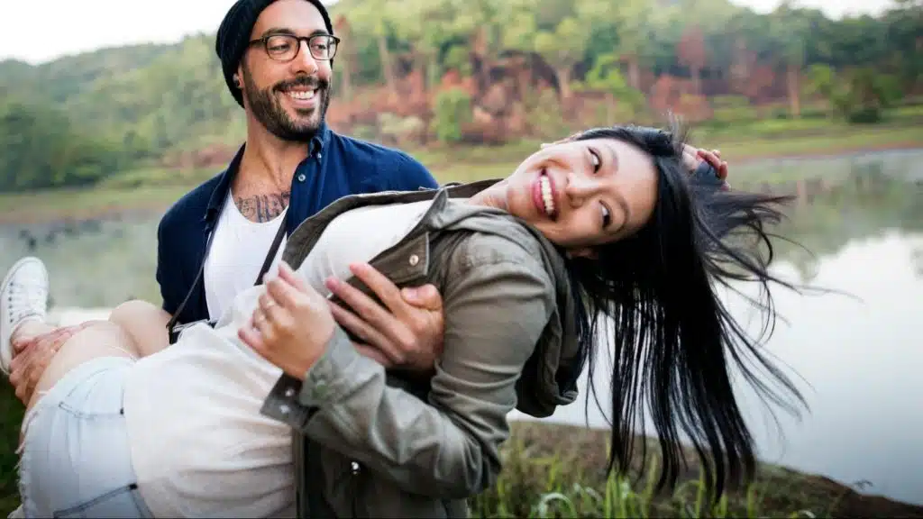 A man carrying woman