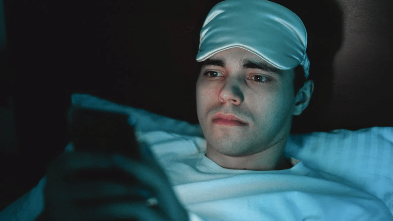 A man looking sad while texting