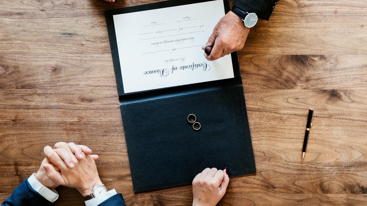 A breakup-marriage couple with divorce certification.