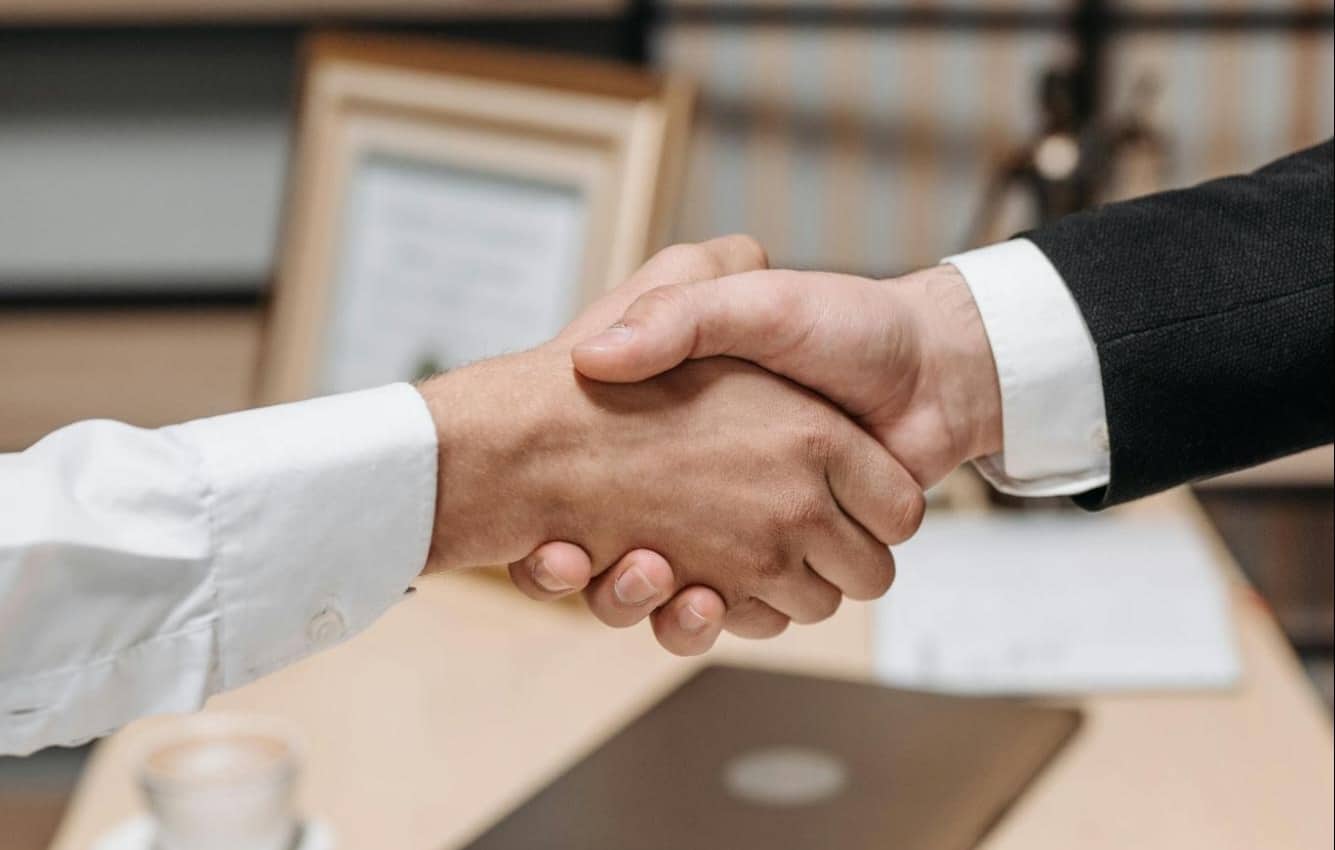 Photo of shaking hands.