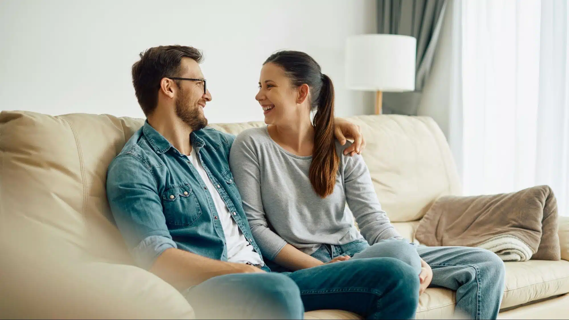 A man and woman at the sofa