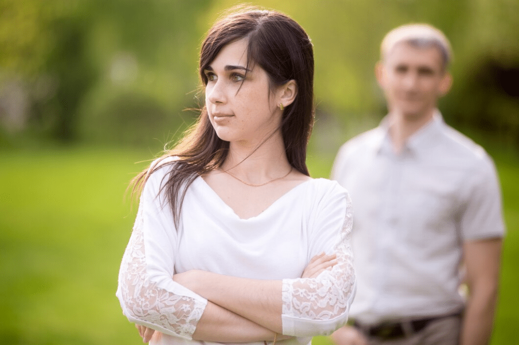 Couple having a misunderstanding outdoors