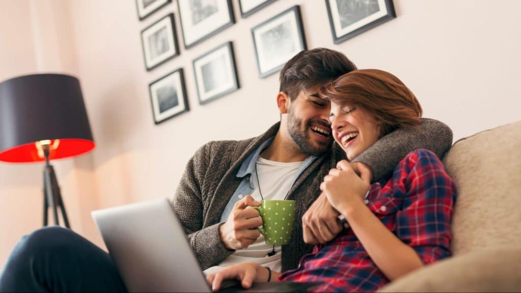 A man and woman laughing together