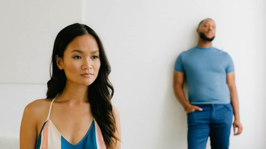 A man and a woman standing next to each other.