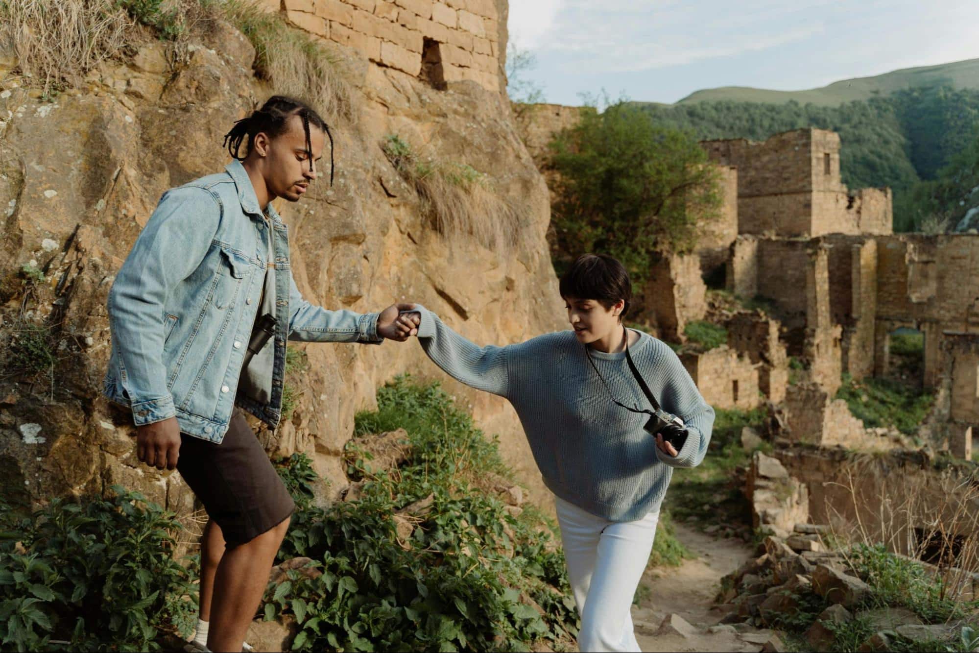 A man leading a woman’s arms.