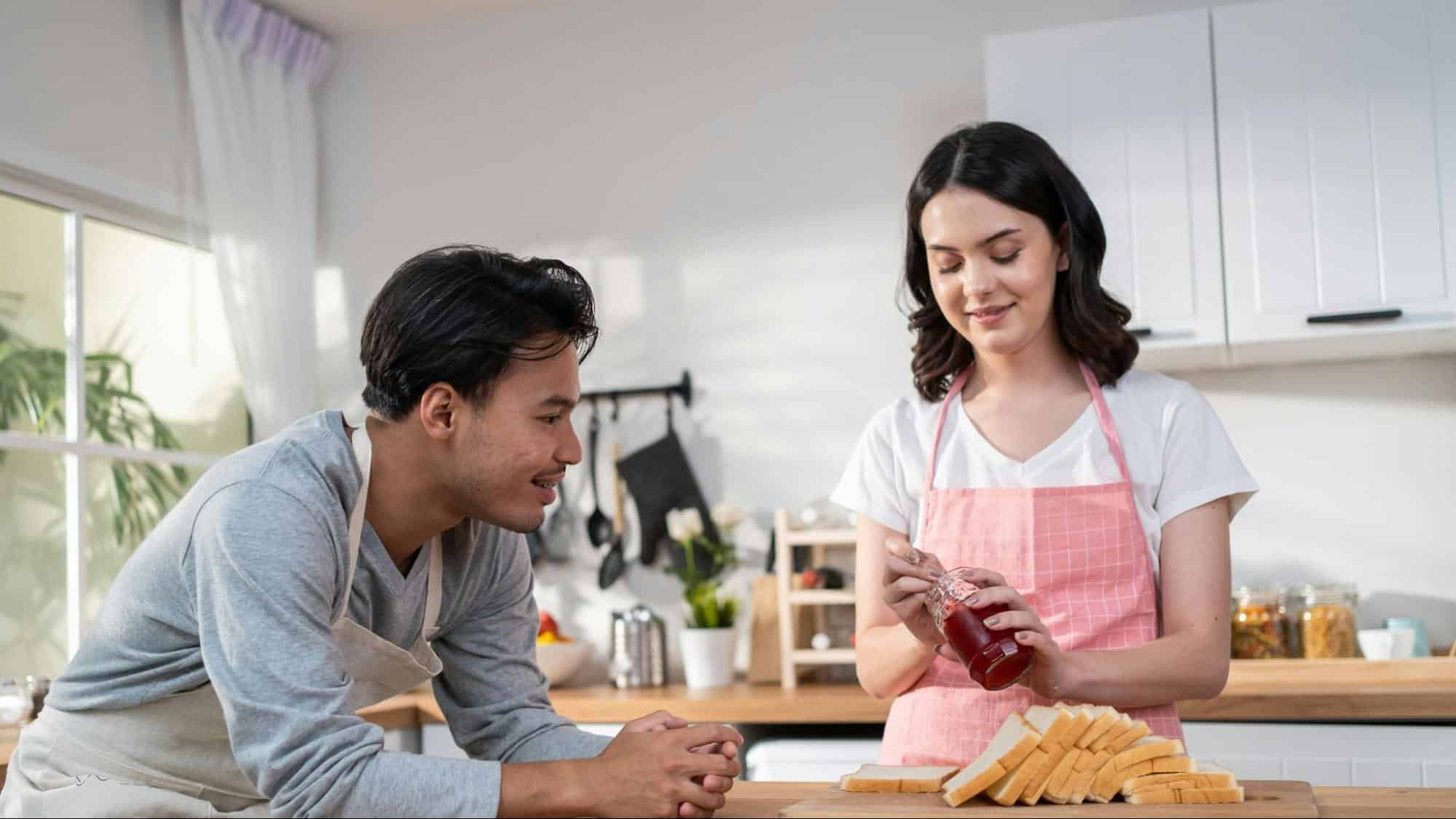 A man and woman at the kitchen