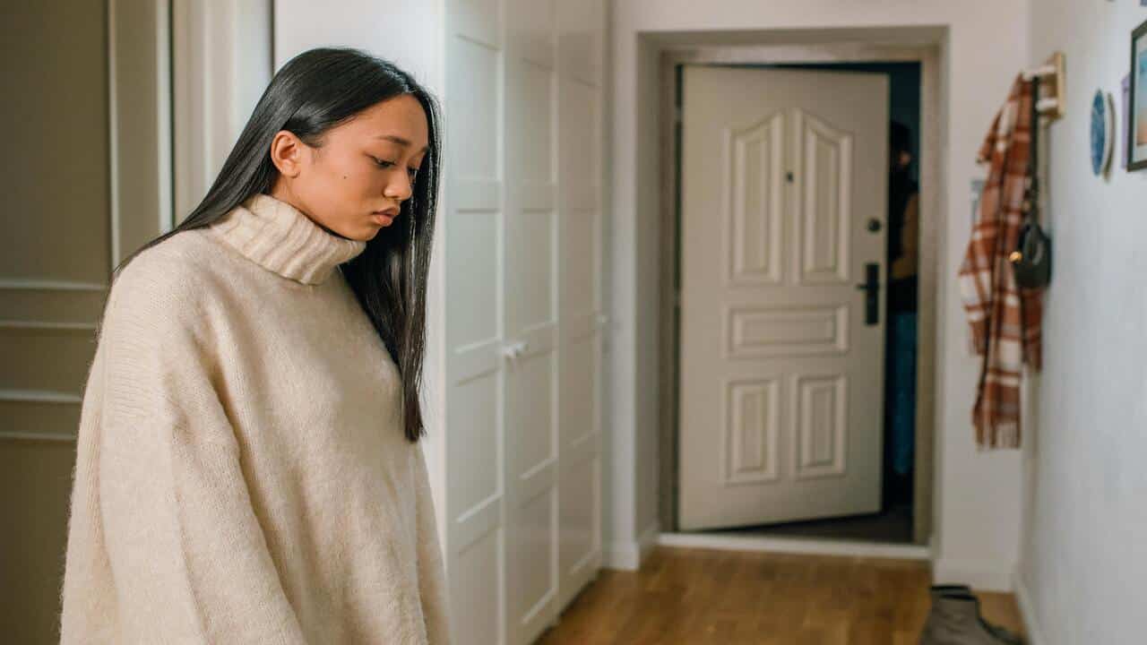 A woman left alone at home