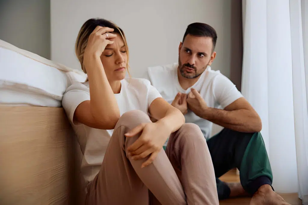 Woman and her husband feeling upset during an argument