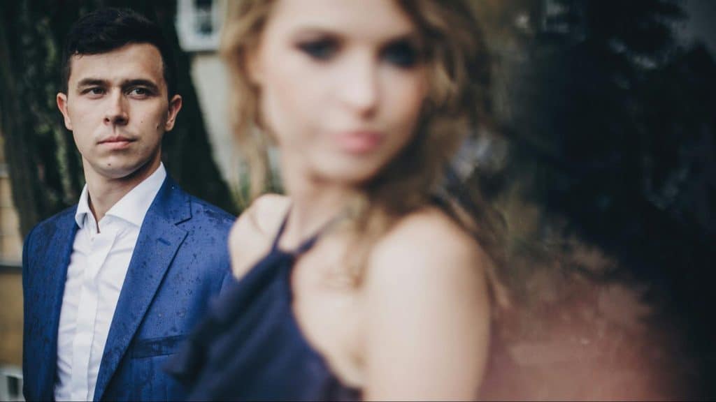 A man looking at the woman
