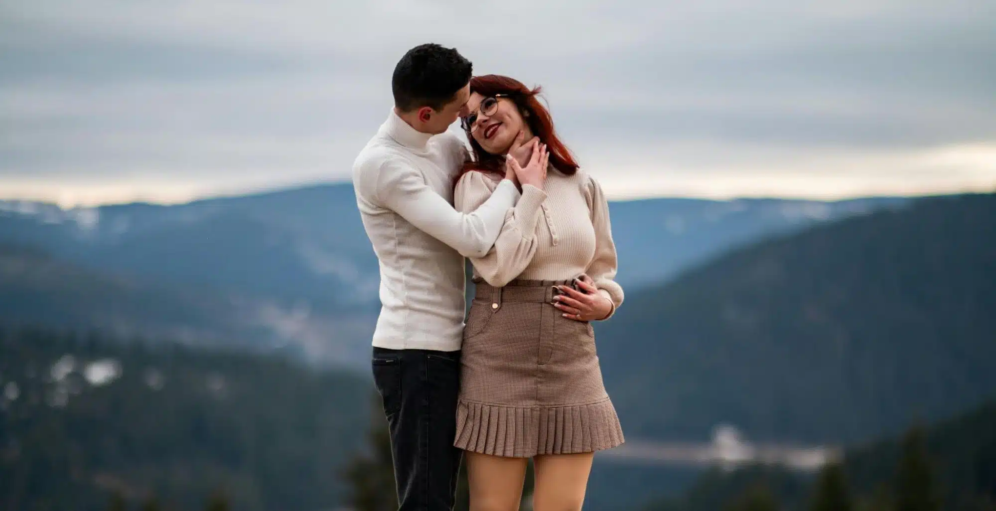 A couple embracing outdoors.