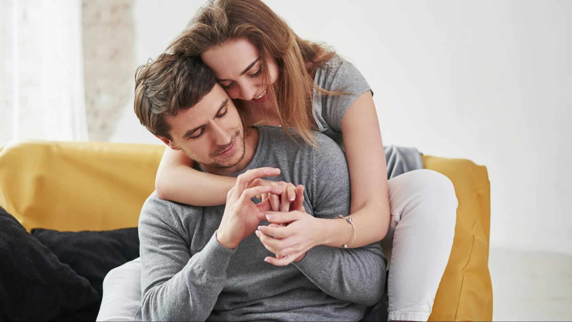 Woman hugging a man 