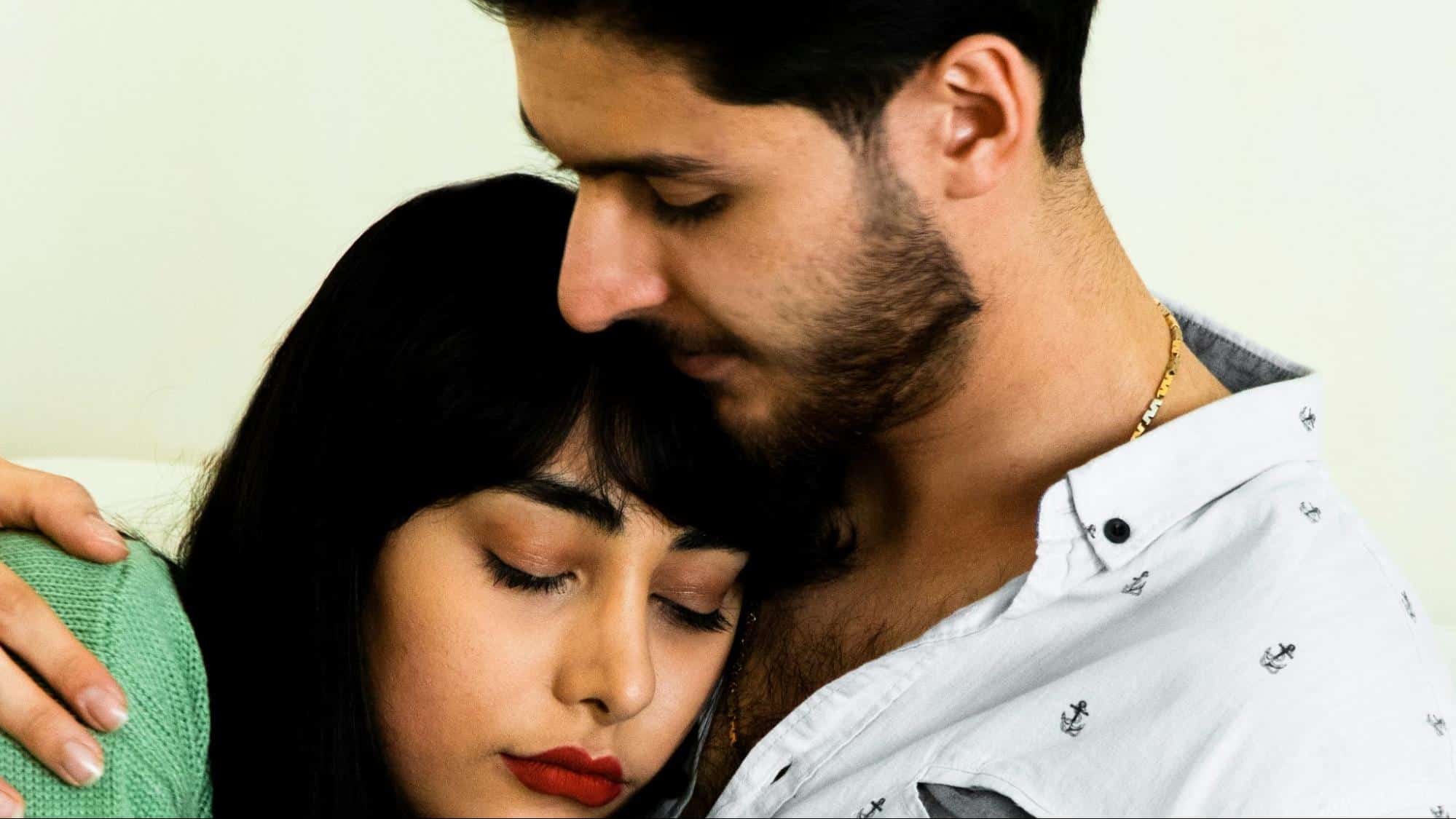 A man embracing woman