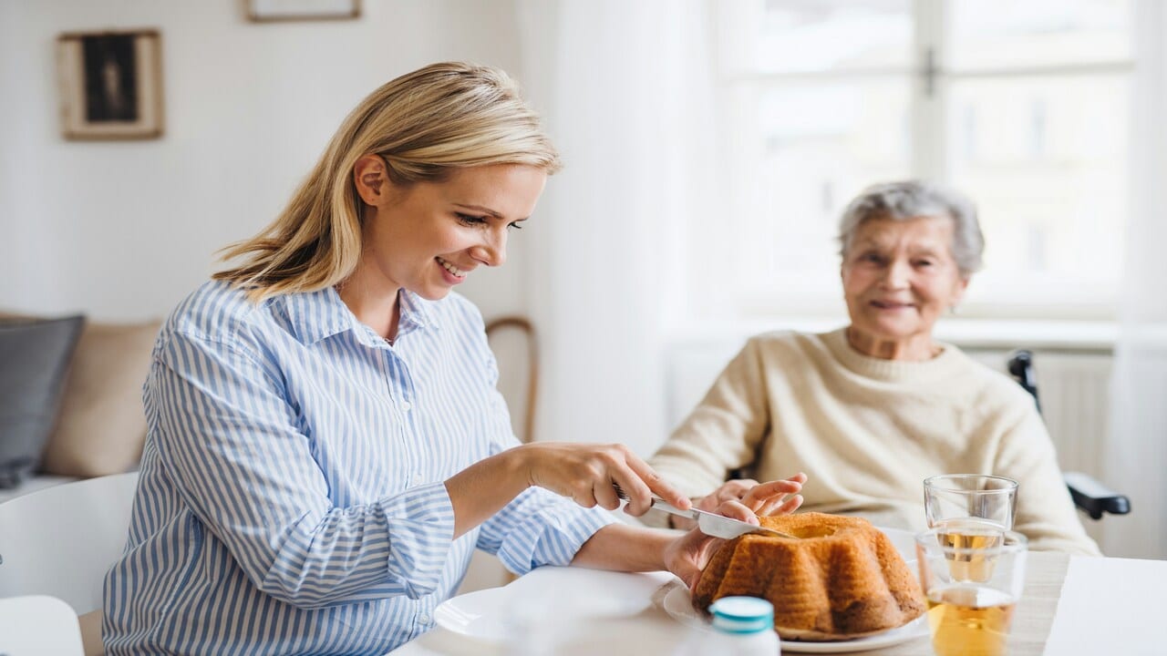 An elderly mom with her adult daughter