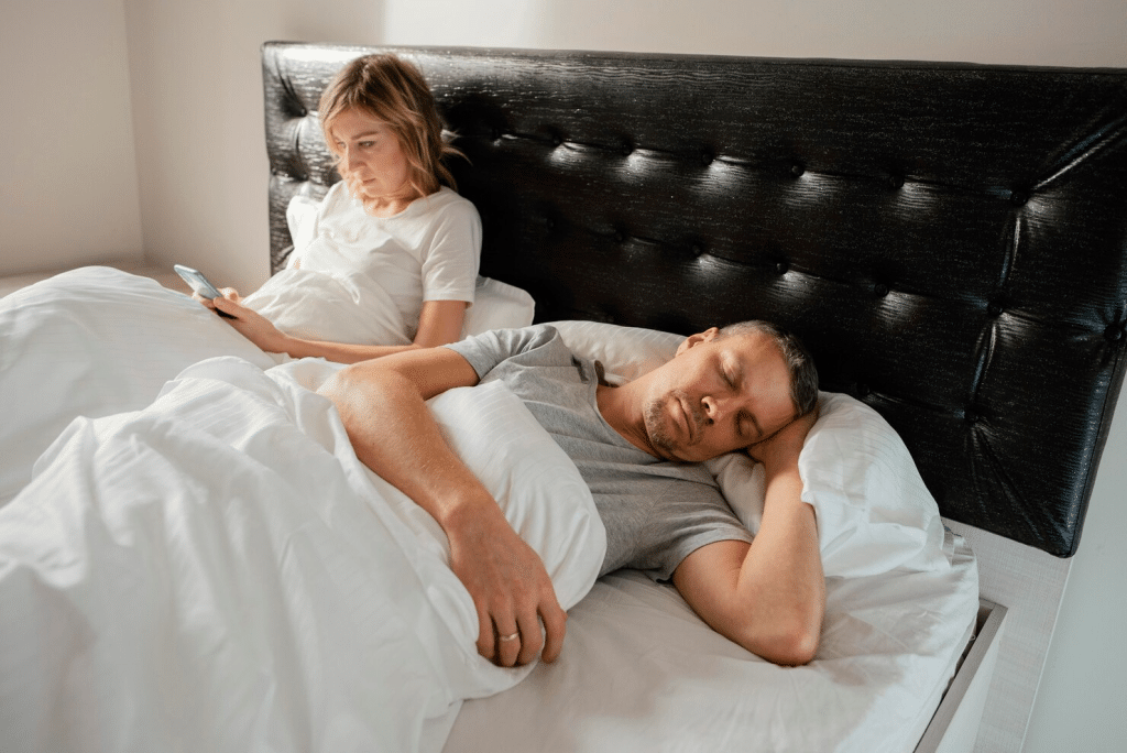 A man sleeps all day and a woman waiting for him