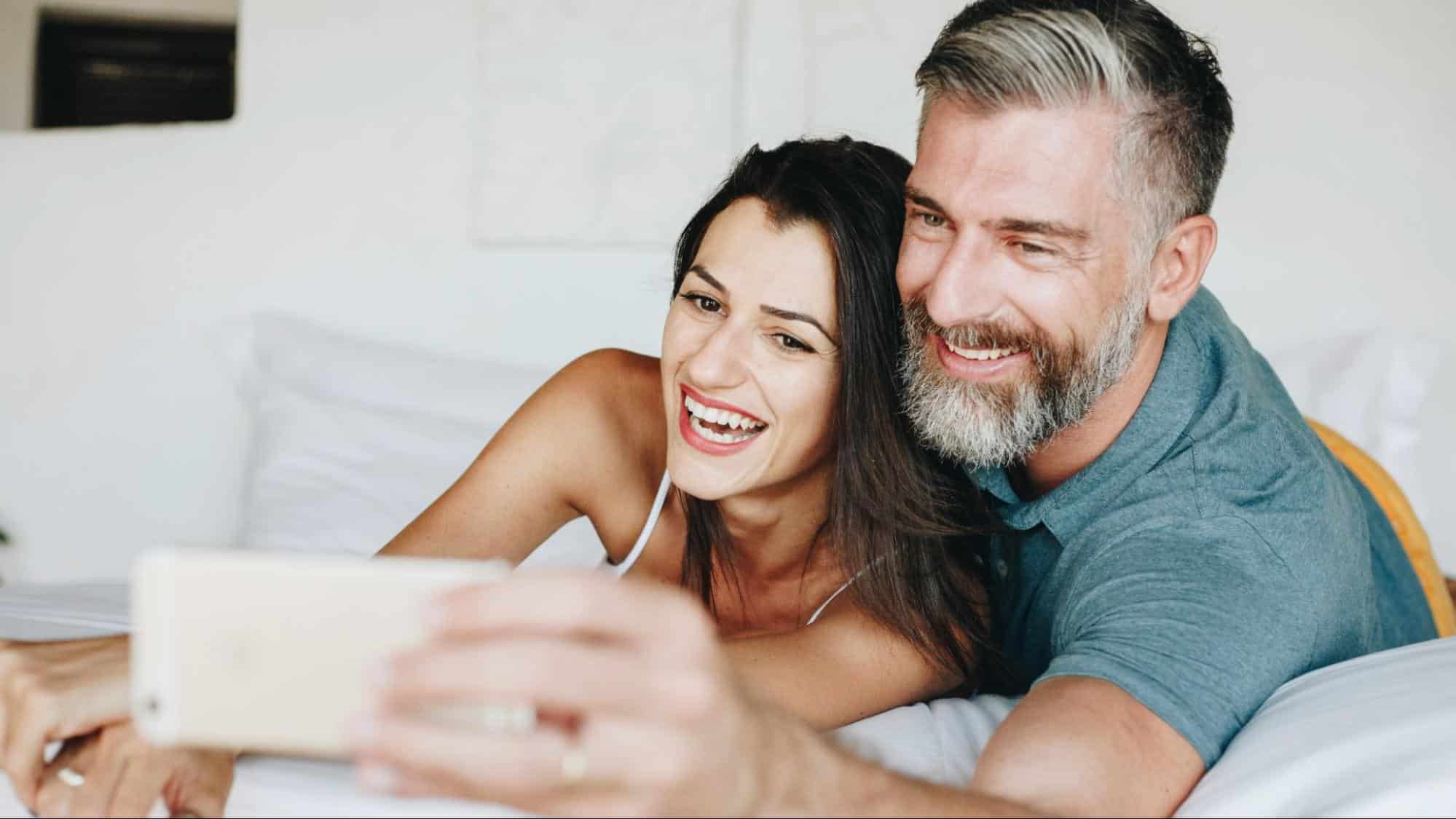 A man and woman taking a picture