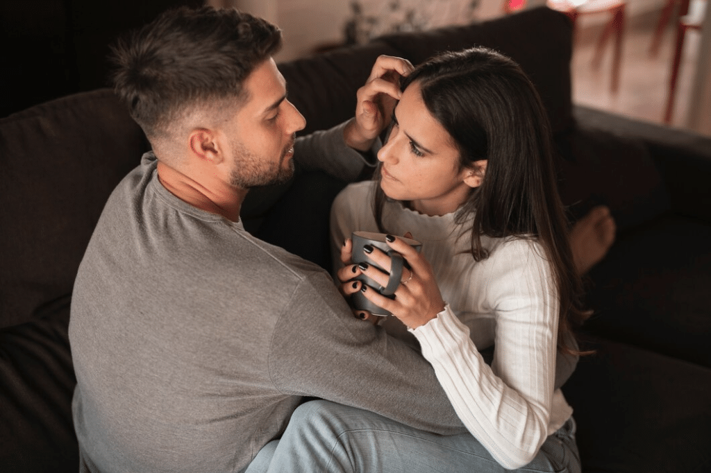 Man holding and comforting distressed woman