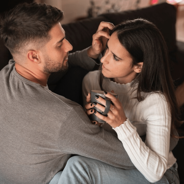 Man holding and comforting distressed woman