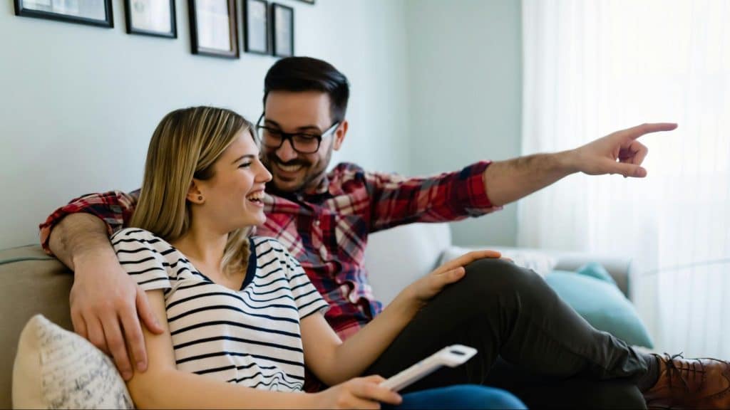 A man and woman smiling