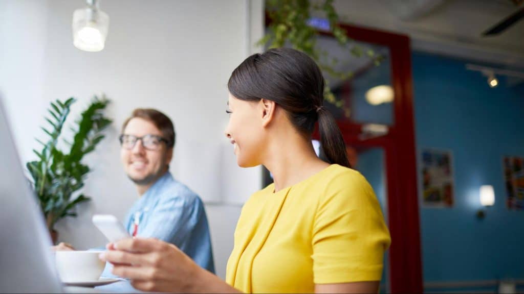 Woman smiling to a man