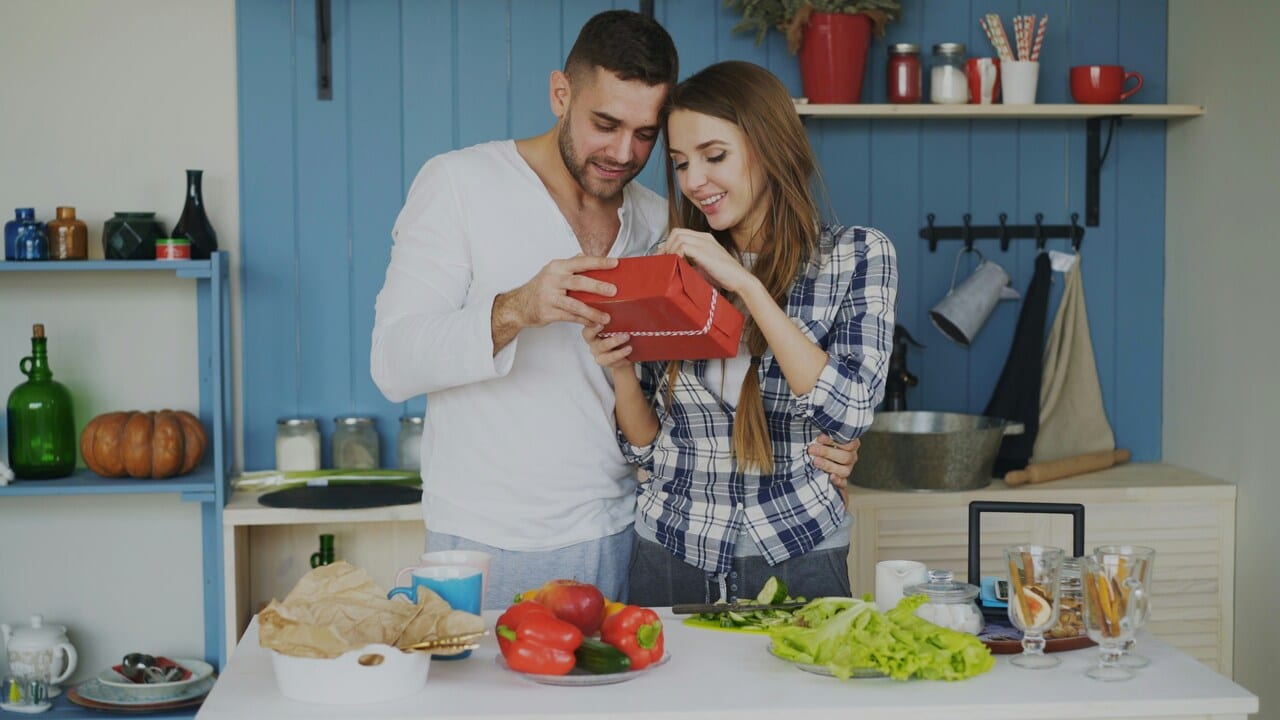 A man giving his wife a gift