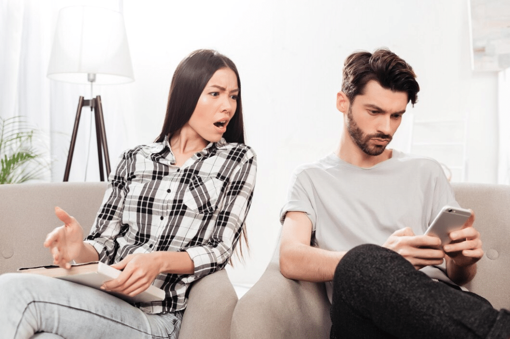 Angry woman at husband on phone