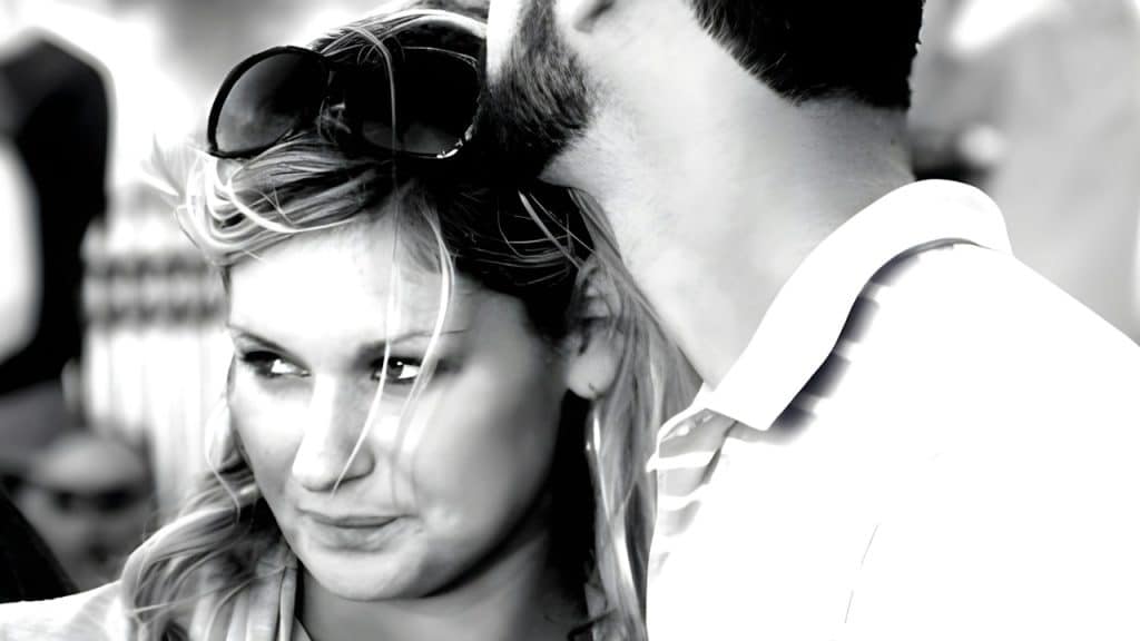 A man and a woman standing close to each other.