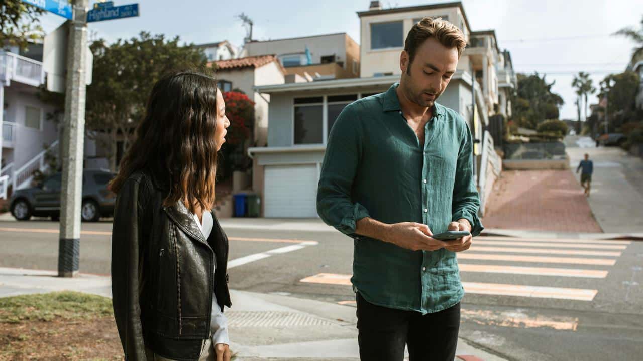A man looks at his phone
