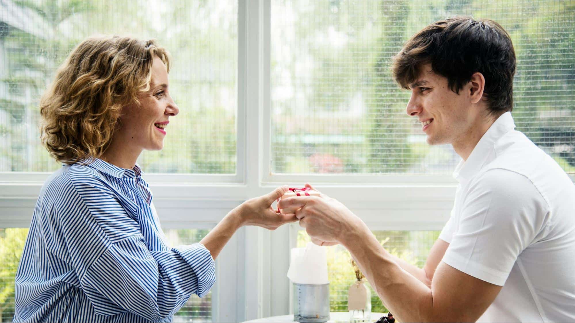 A man and woman smiling at each other