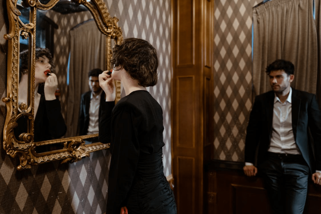 A Woman Looking at the Mirror with a Man