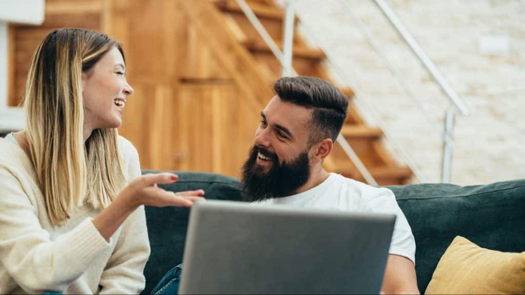 A man and woman smiling at each other