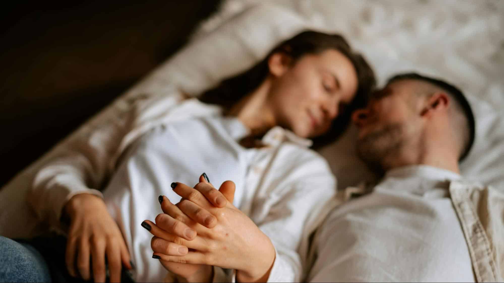 A man and woman holding hands
