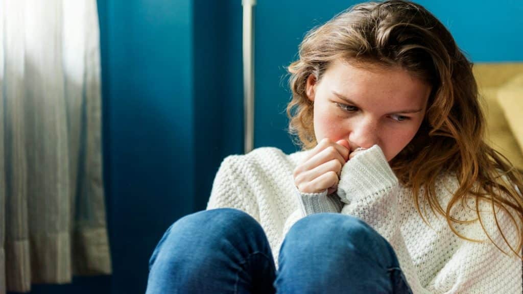 person feeling uneasy alone