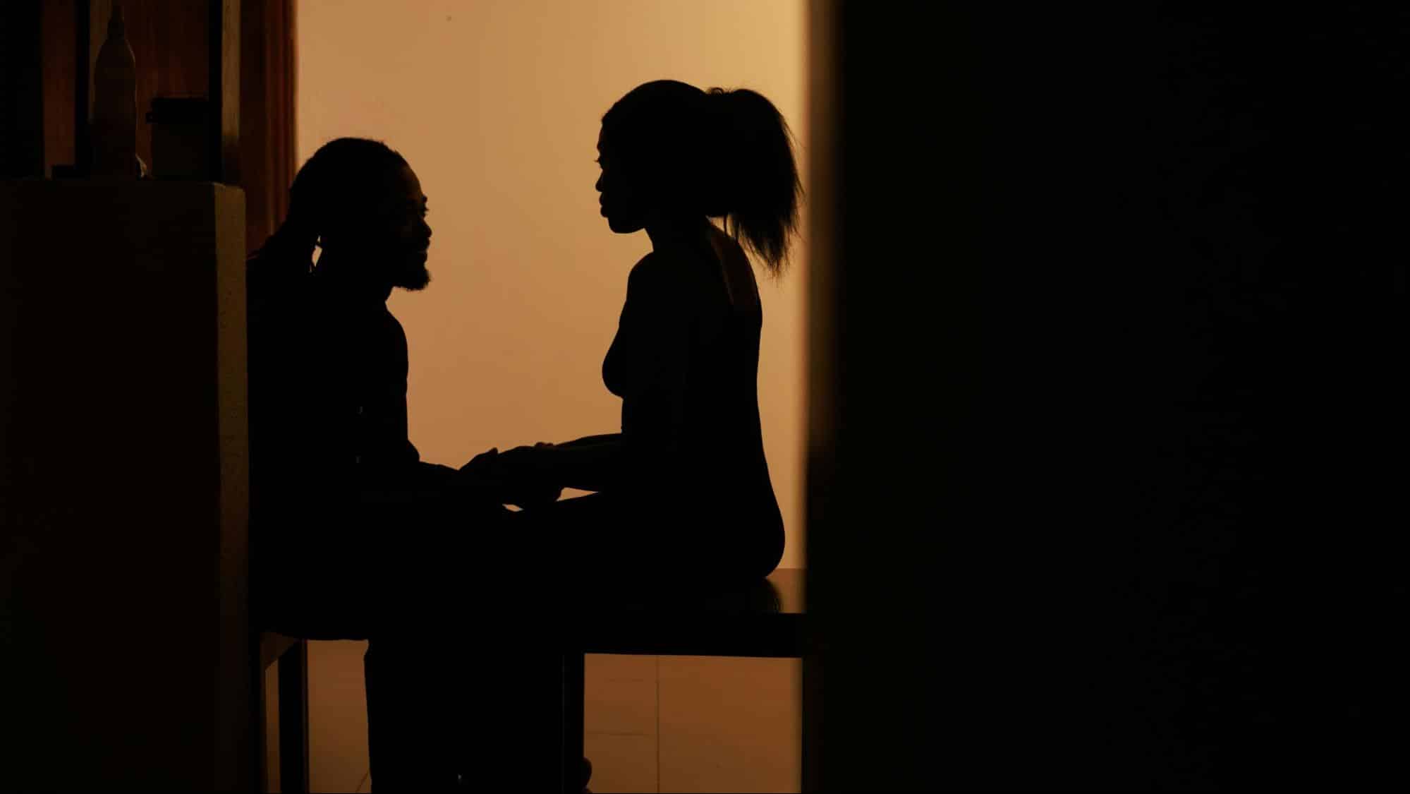 Shadow of a man and woman talking