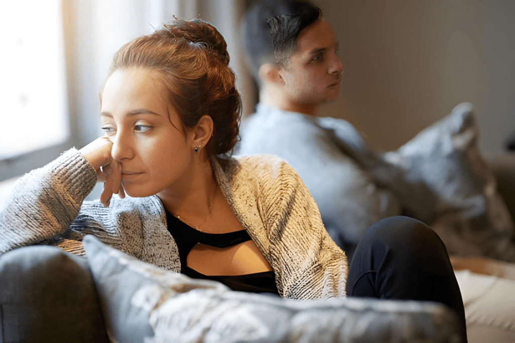 Woman looking despondent after a fight with her boyfriend