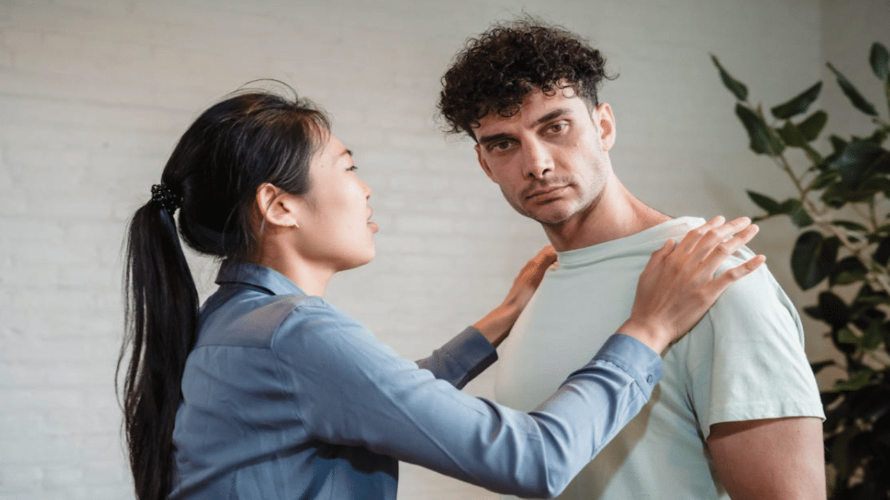 A man refusing to look at his crying girlfriend
