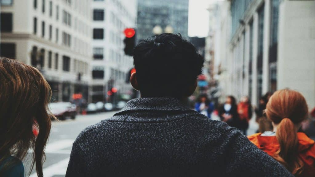man engaged in person but distant afterward