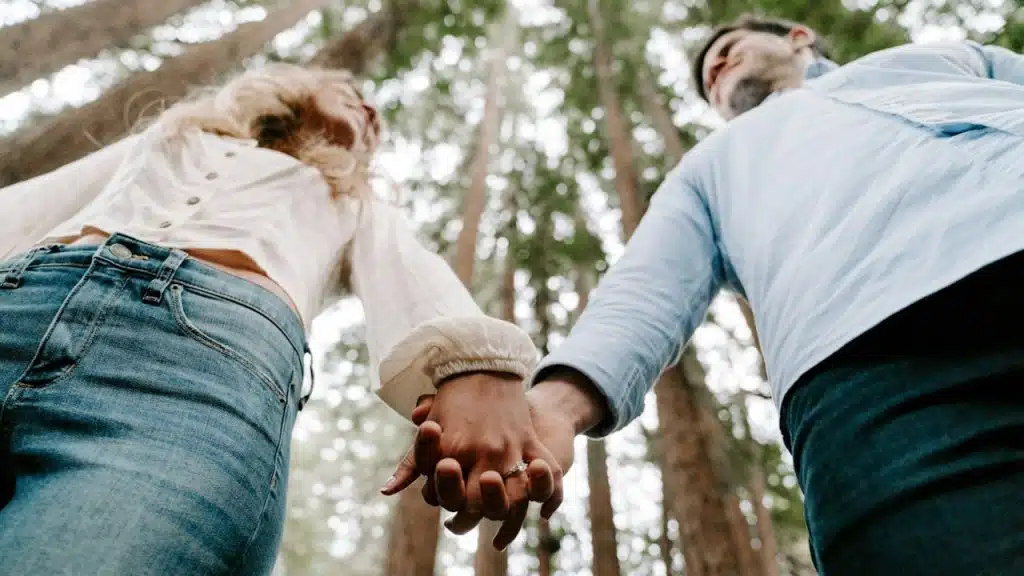 A man and a woman holding each other's hand.
