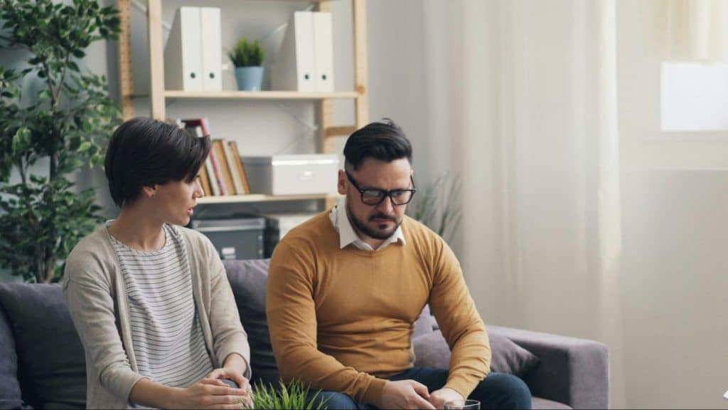 A man and woman talking