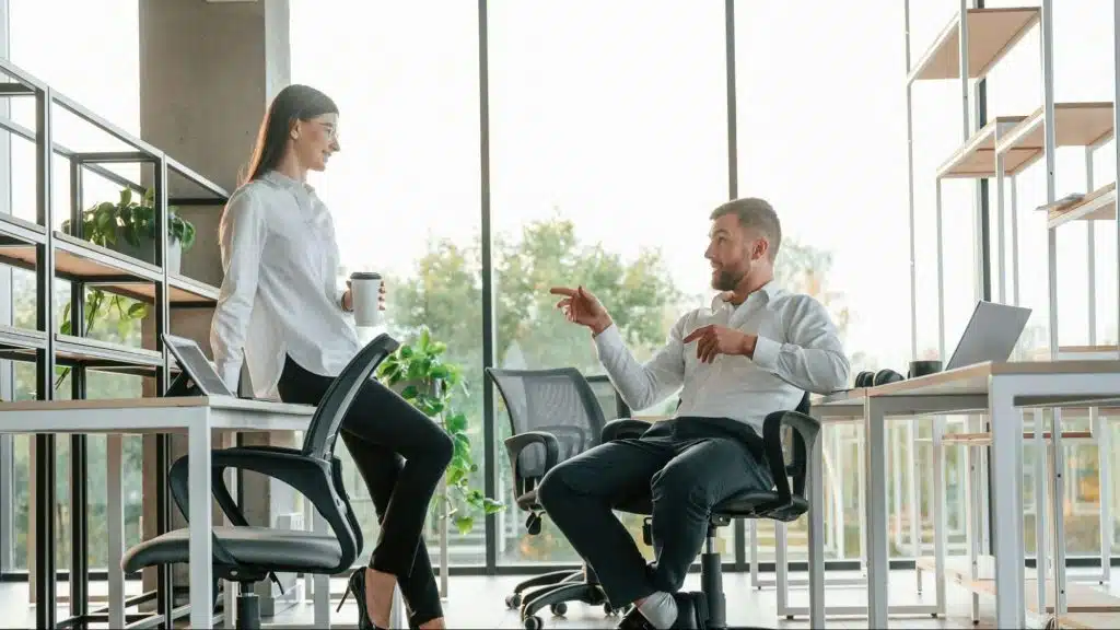 A man explaining to woman