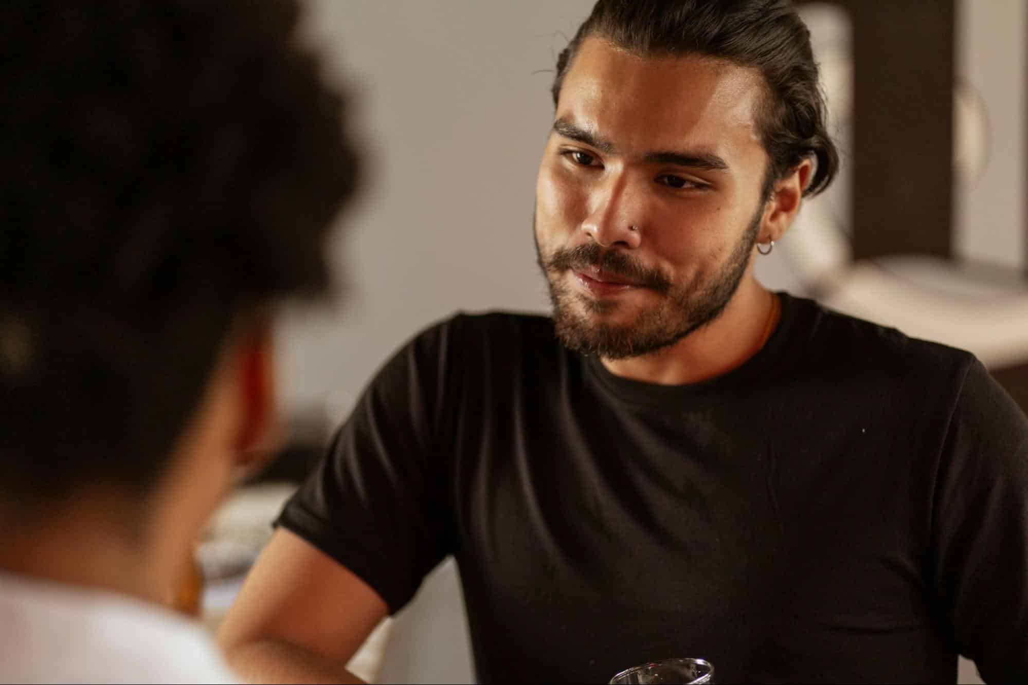 A man listening.