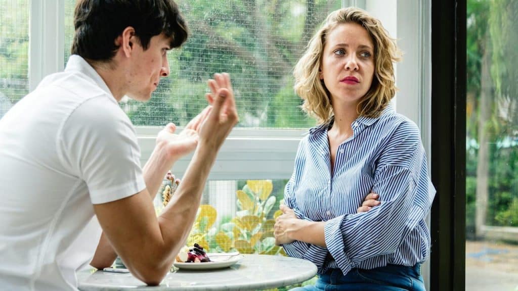 A couple is having an argument at the cafe.