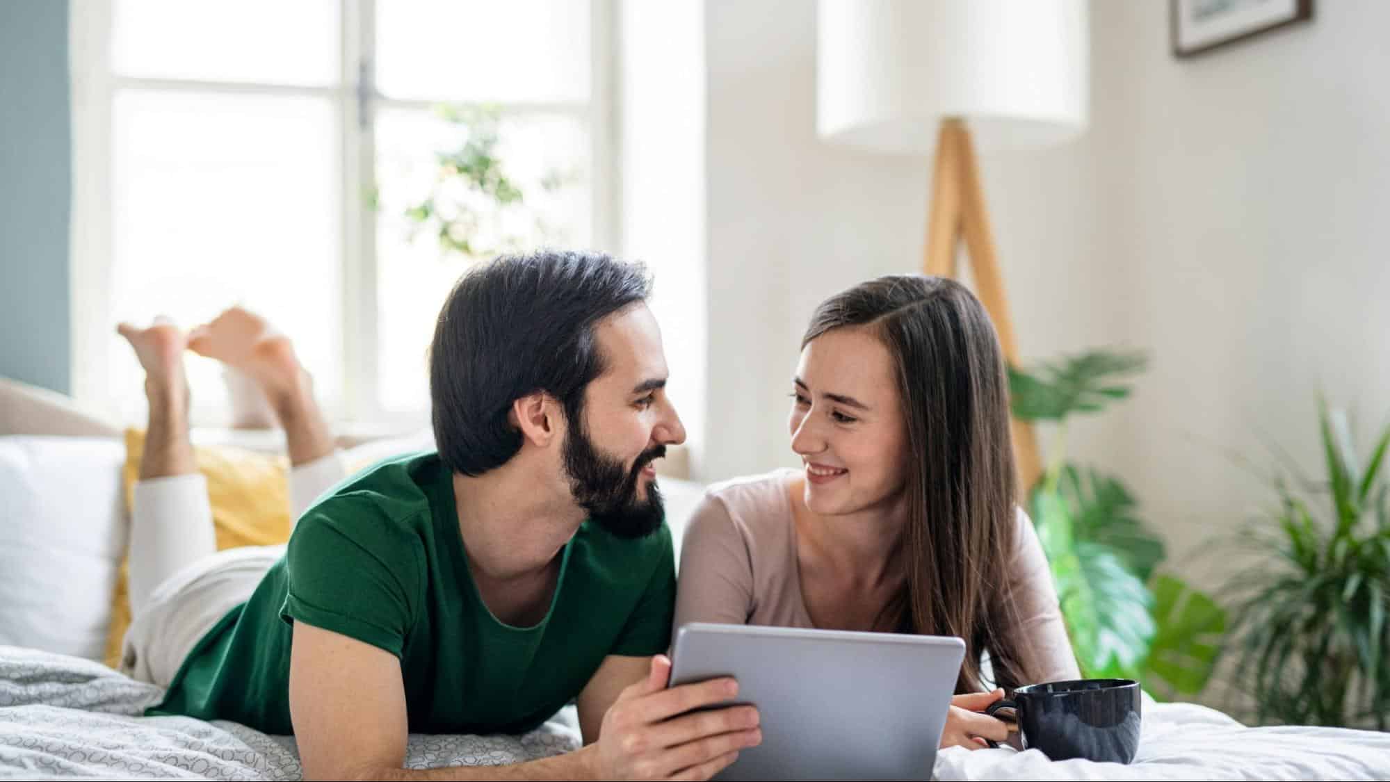 A man and woman helping each other