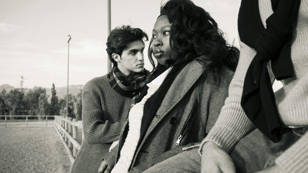 A man and a woman looking away from each other.