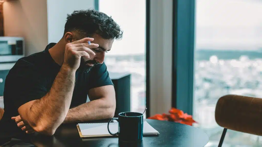 man reflecting on past interactions