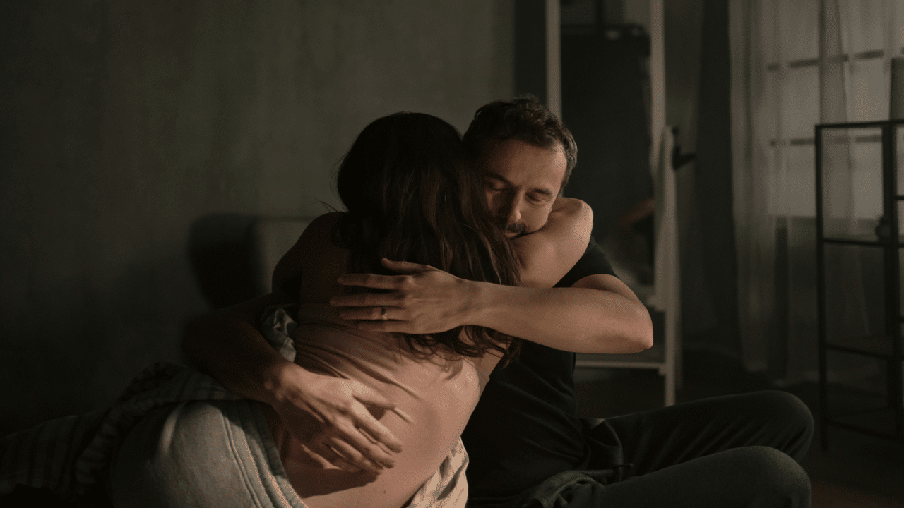 A couple giving each other a hug
