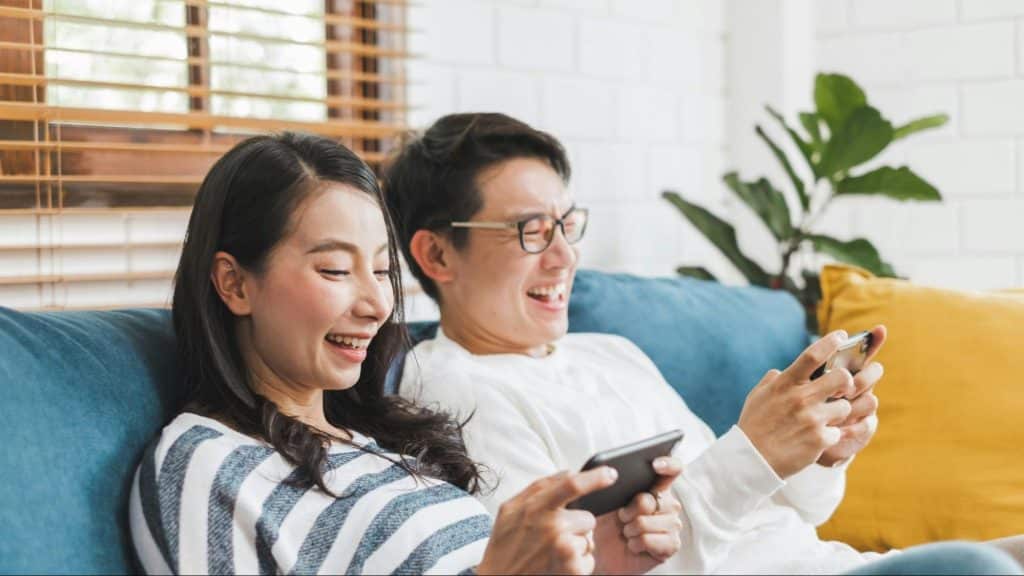 A man and woman playing games together