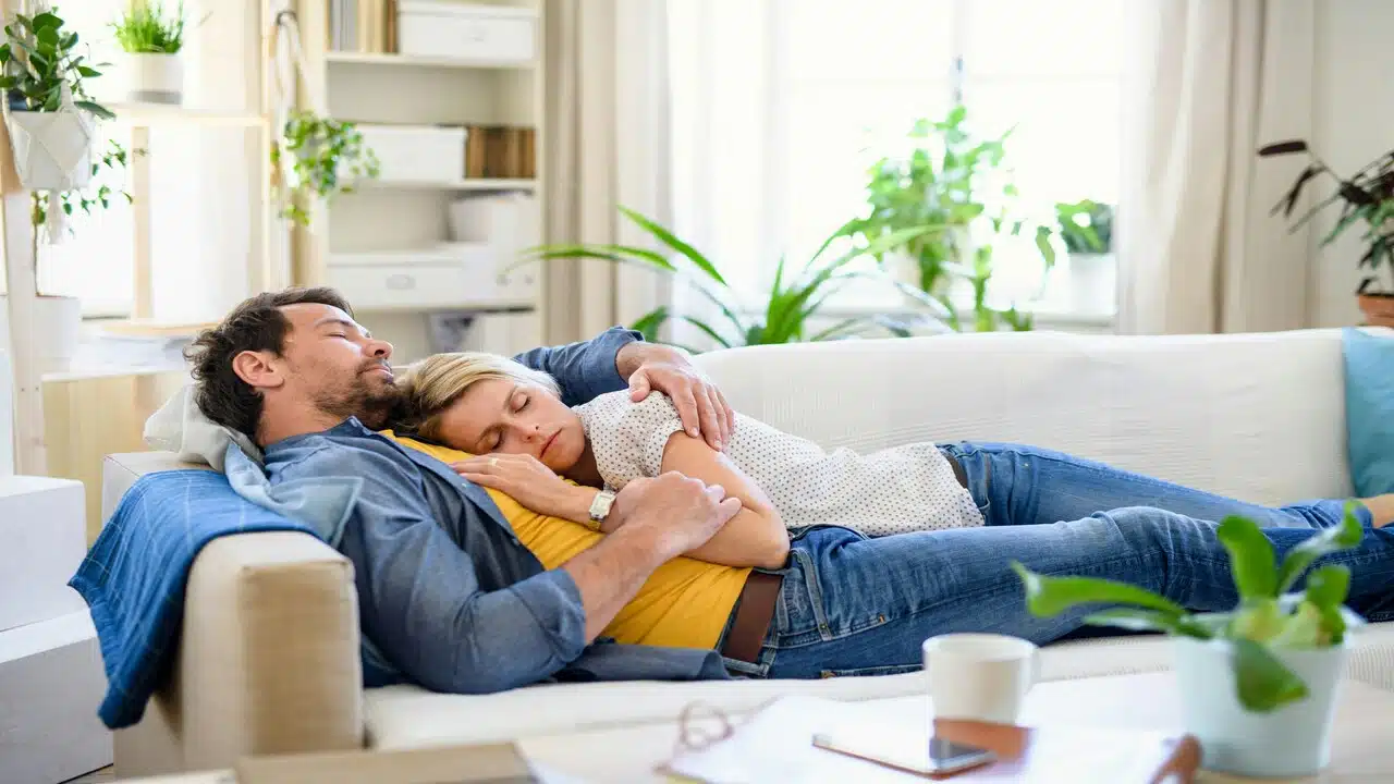 A couple taking a nap together
