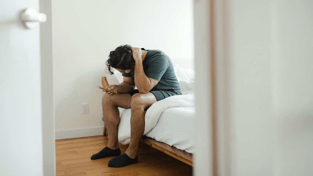A man looking upset at home