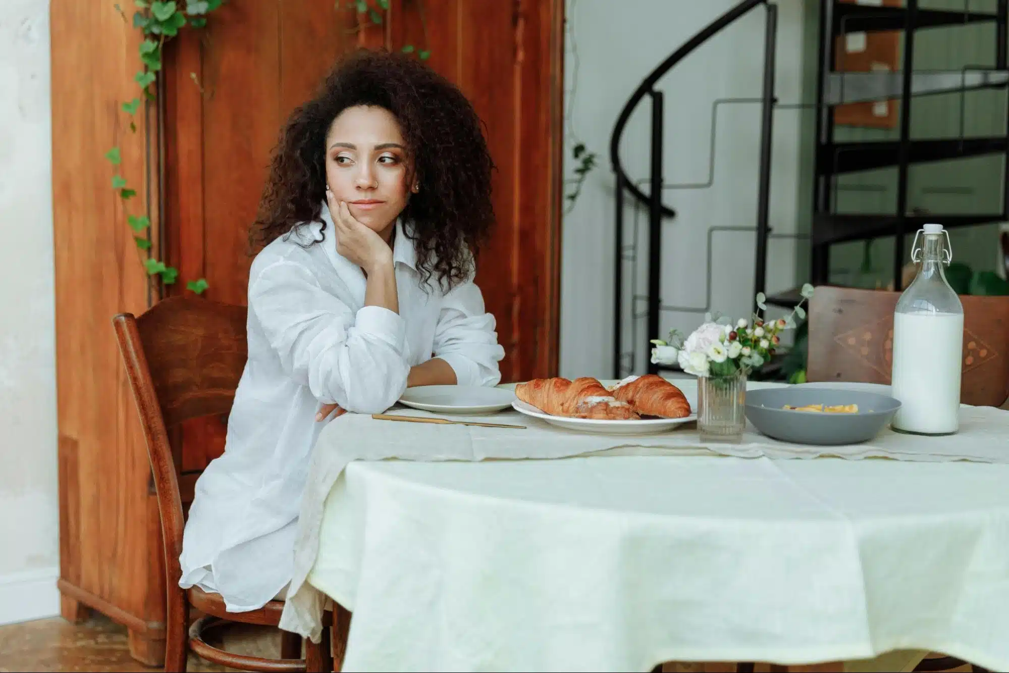 A woman sitting alone by the table.