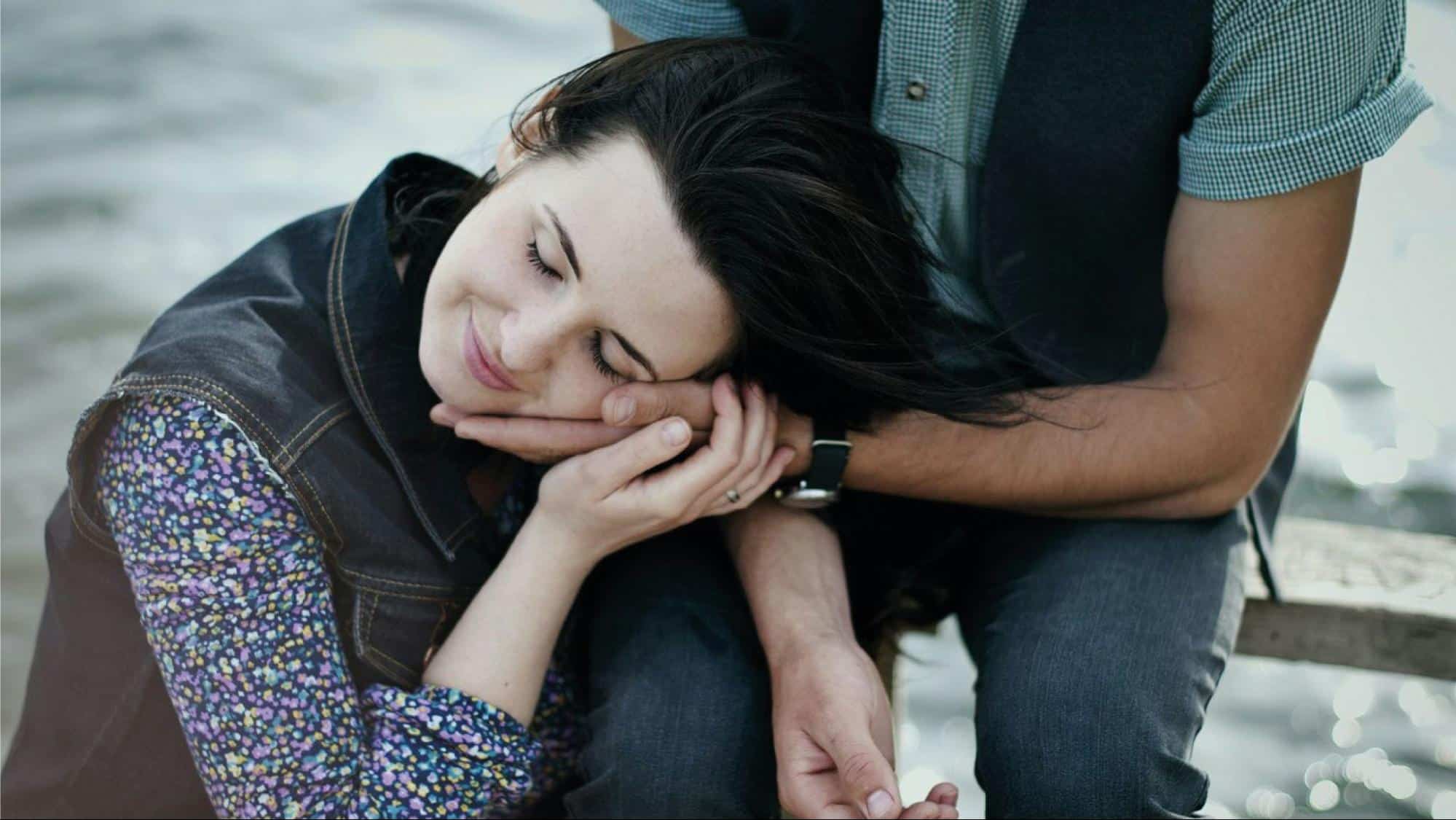 A man letting a woman to rest on her hand